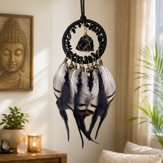 The Journey Guardian dreamcatcher hanging in a living room with a Buddha statue
